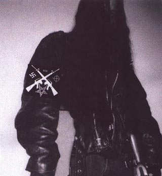 black metal warrior ready to spread death in the sign of the gammadion, pentagram, knight's cross and unholy number